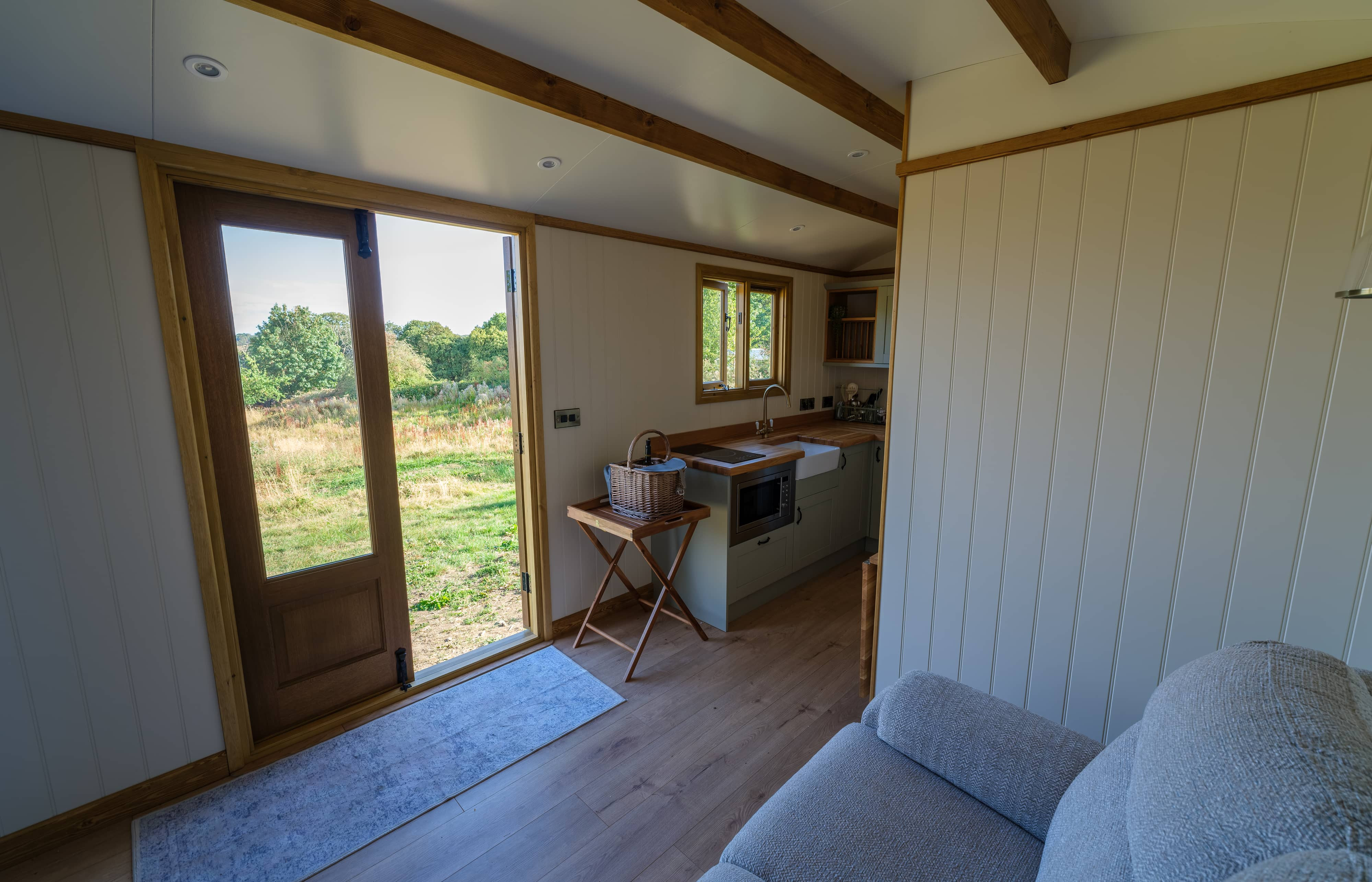 Looking out from the kitchen through the open double doors to the meadow